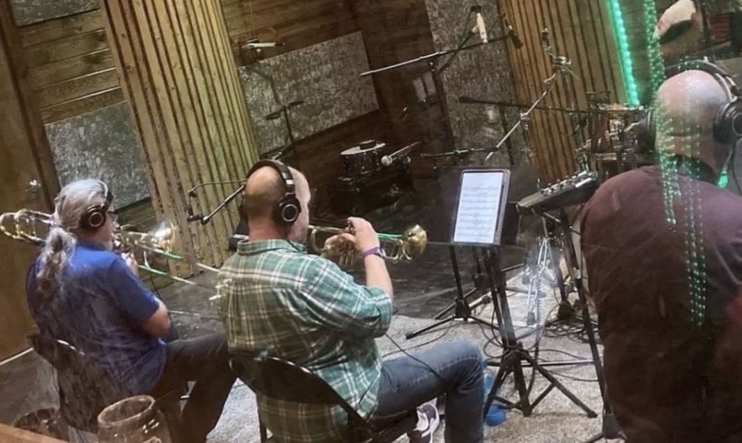 Musicians working in studio